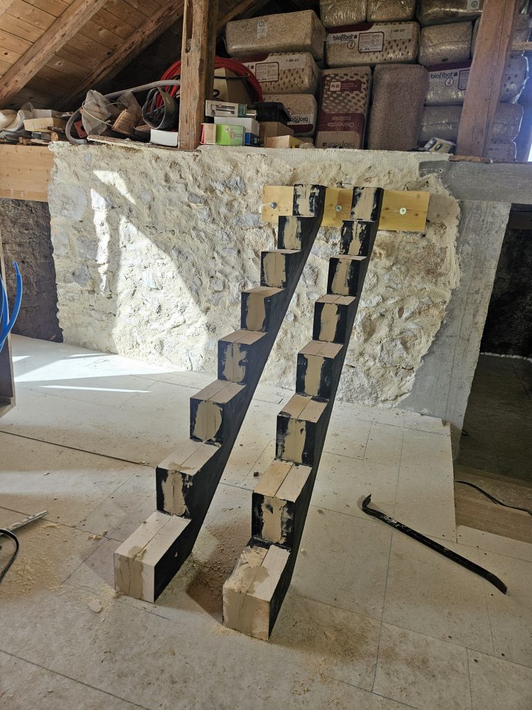 pose de limons sur mesure en bois pour escalier dans une grange en pierre